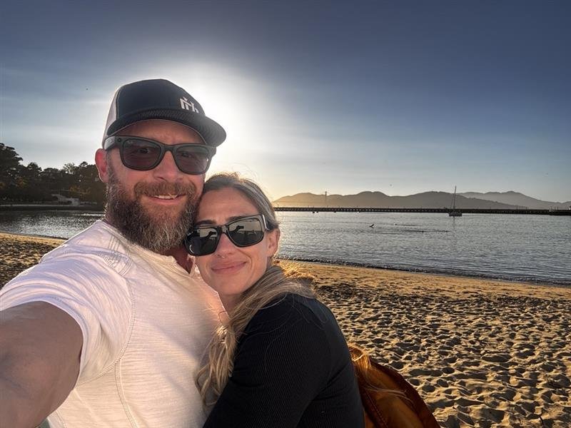 Ken Guffey with his partner on the beach