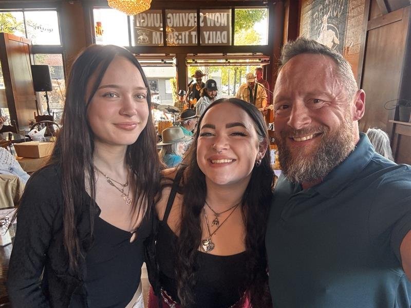 Ken Guffey with his daughters