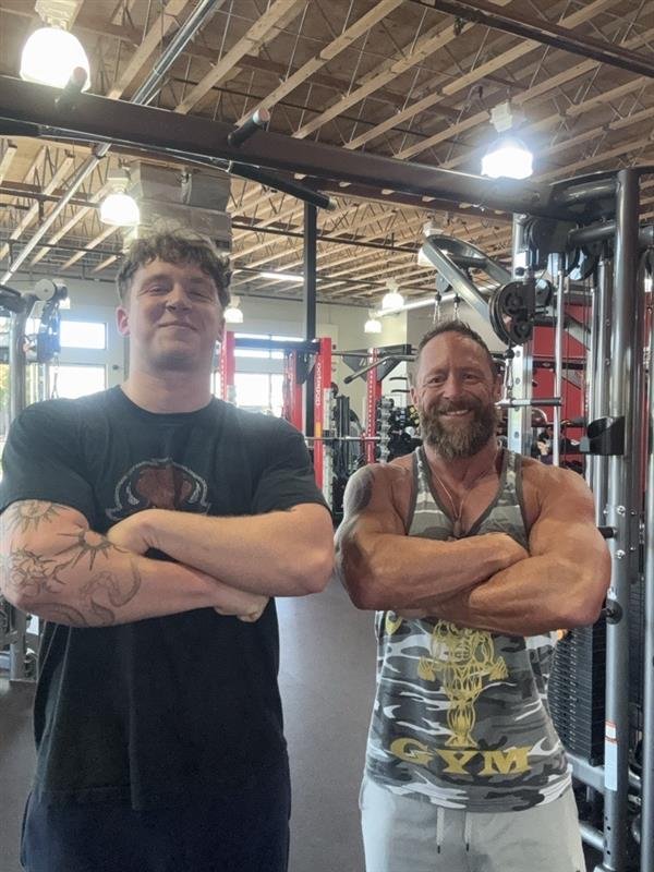 Ken Guffey in the gym with his son